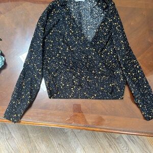 Black with white and yellow. Short top Dex size small.